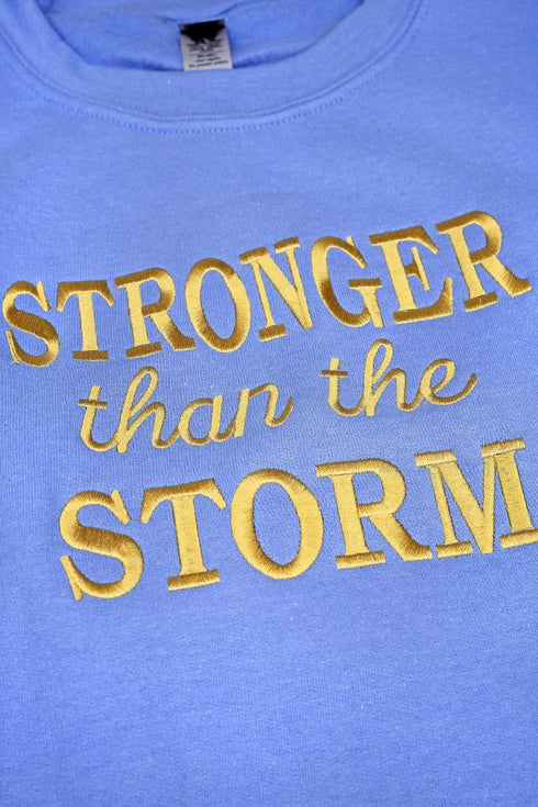 Embroidered Stronger Than The Storm Unisex NuBlend Crew Sweatshirt