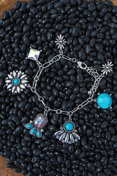 Turquoise High Stakes Silvertone Charm Bracelet
